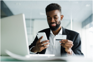 A man paying his monthly student loan payment